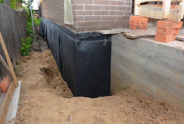 SJ Waterproofing Pros technician performing targeted Exterior Waterproofing assessment in Madison, WI